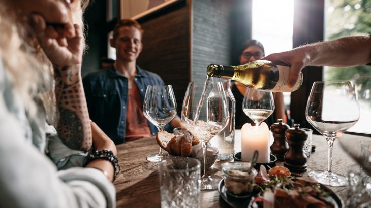 People who drink a glass of wine a day may have a lower risk of hospitalizations than heavy drinkers and those who don’t drink at all.