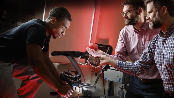 Nebraska researchers Karsten Koehler (second from right) and Christopher Gustafson (right) have found that a person's choice of post-workout snack – an apple vs. a brownie, in a recent experiment – can depend on when the choice is made. Study participants who decided before exercising were about one-third more likely to choose an apple than were those who decided afterward.