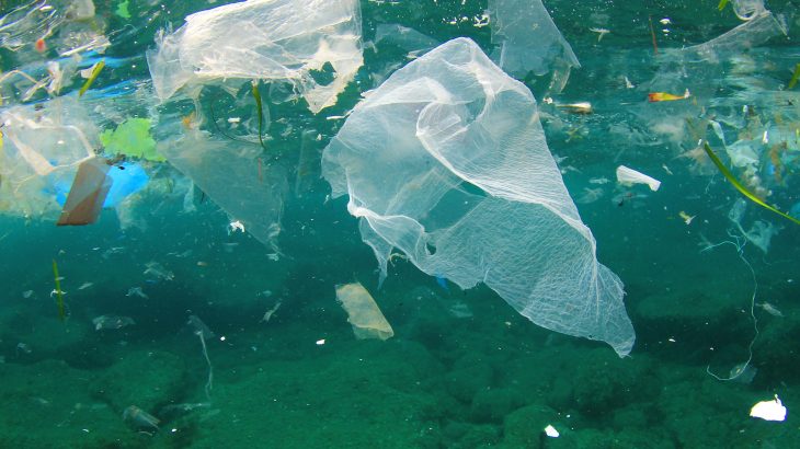 Adhesive substances secreted by bacteria in the ocean are essentially gluing plastic particles together to form large agglomerates.