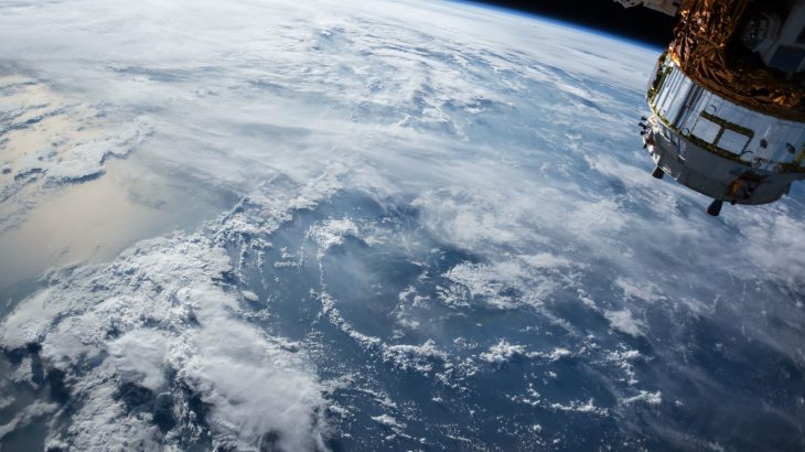 A satellite in orbit over the earth.