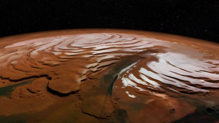 Scientists have found a surprisingly large amount of frozen water buried beneath the sandy surface of Mars.