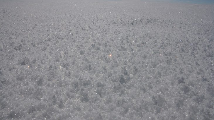 According to the European Space Agency, the extent of the sunlight that can be bounced off of snow is affected by its grain size.