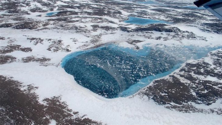 A frozen meltwater lake is near the northeast coast of Greenland's ice, as seen from NASA's P-3B aircraft on May 7, 2012. (Image credit: Jim Yungel/NASA)