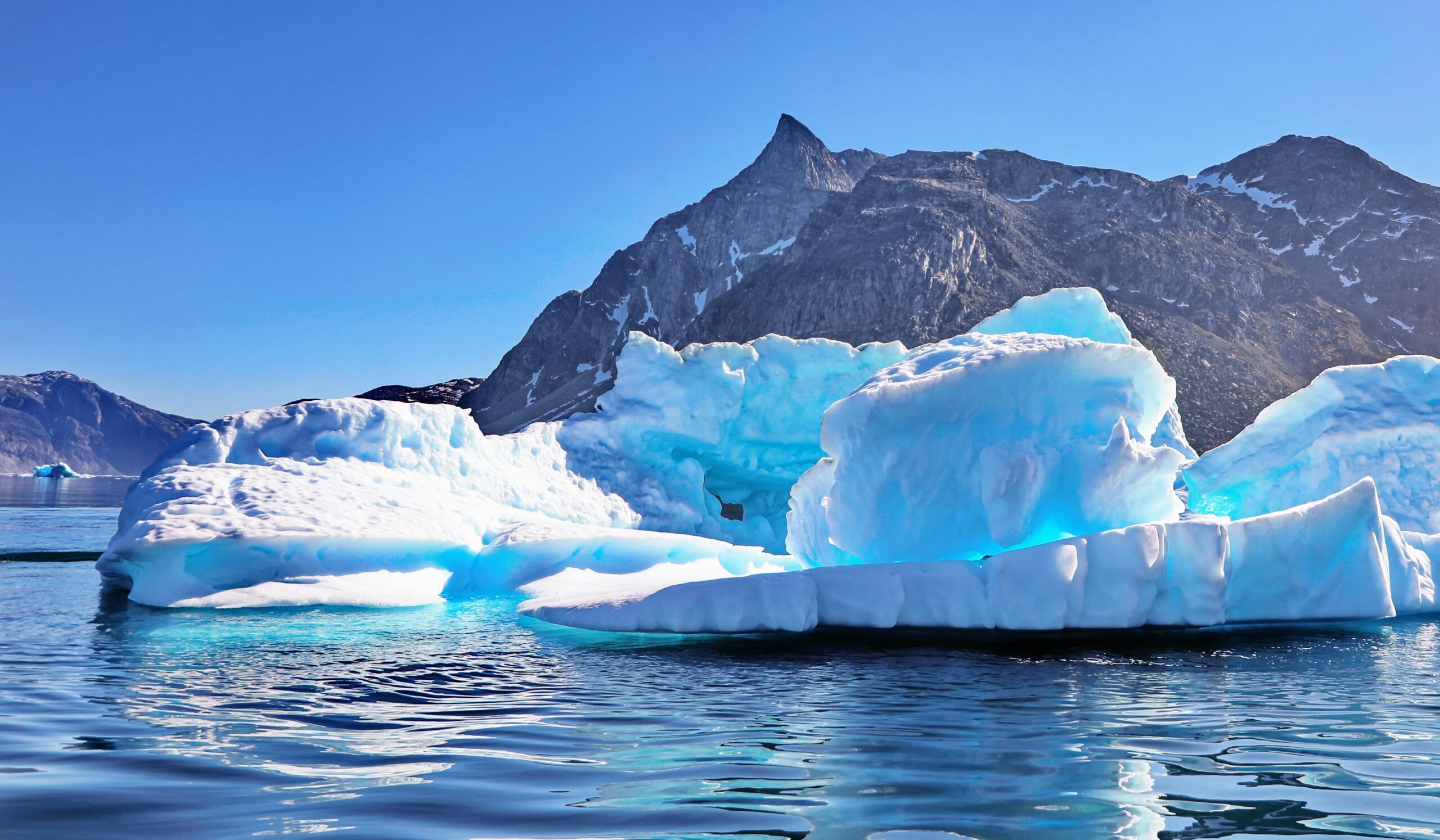 Ice is melting faster in Greenland, and slower in Antarctica