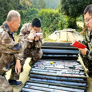 Technicians of Hunan Province Geological Disaster Survey and Monitoring Institute check rock samples at the Wangu gold field in Pingjiang County, central China's Hunan Province. Credit: Xinhua/Su Xiaozhou