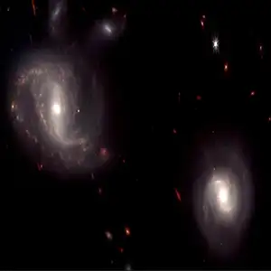 Two interacting luminous infrared galaxies, designated as IRAS 09111-1007, from the survey. The galaxies already passed through each other once and are coming back on a second approach. Credit: Great Observatories All-sky LIRG Survey