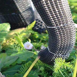 EPFL researchers have pioneered a 3D-printable, programmable lattice structure for robotics that mimics the vast diversity of biological tissues – from a flexible trunk to rigid bone – using a single foam material. In this photo, EleBot's trunk is picking a flower. Credit: EPFL