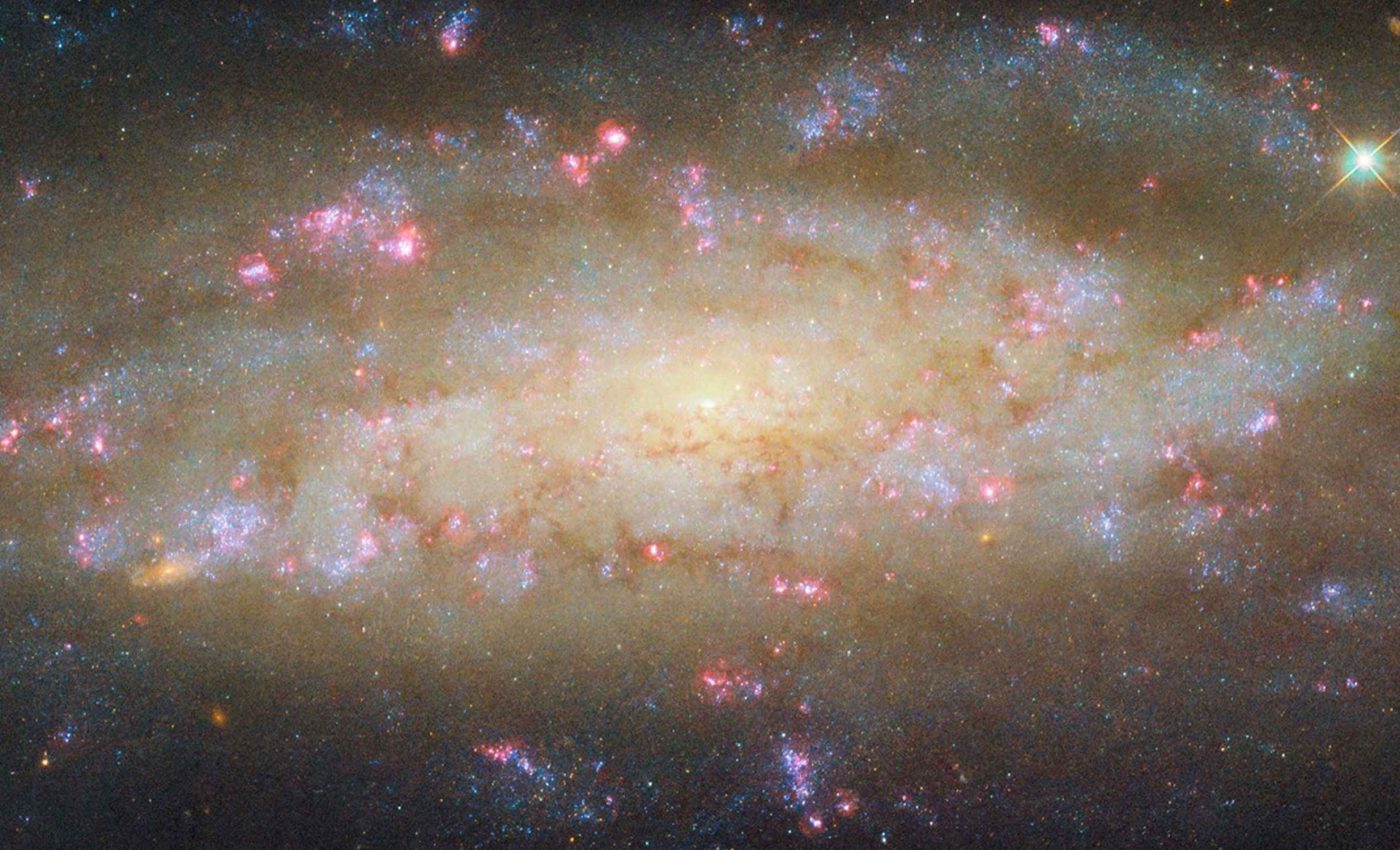 NASA captures an image of a distant galaxy bursting with life