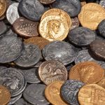 Two hobbyists find a treasure trove of over 400 perfectly preserved Roman and British coins in a field