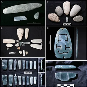 Greenstone objects found in Caches NR6-9. (A) The large incised object probably depicts a crocodile. (B) It contained five greenstone axes and an ornament arranged in a flower-petal form but probably had more objects. (C) The cache contained 18 stone objects placed in a cruciform pattern. (D) Front and side view of a thin jade plaque found in the central part of Cache NR9. (E) Two sides of the jade objects, each with two transverse perforations. (F) Side view of the first object from the left in (E). (G) Side view of the third object from the left in (E). (H) Pectoral probably representing a bird found in the central part of Cache NR9. Credit: Science Advances