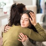 Why warm hugs and skin cues strengthen our sense of identity