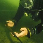Divers discover a hoard of medieval spears from tranquil Polish lake