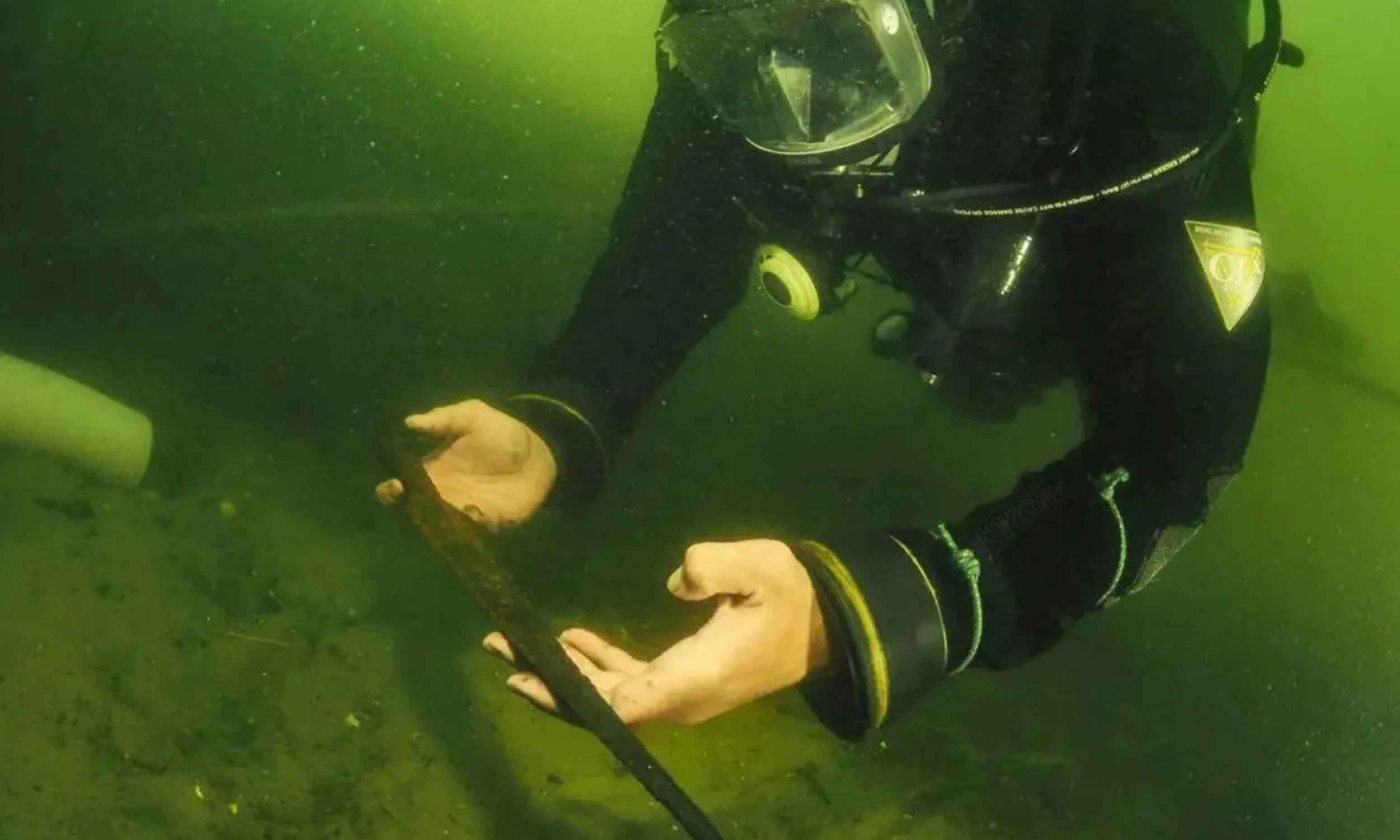 Divers discover a hoard of medieval spears from tranquil Polish lake