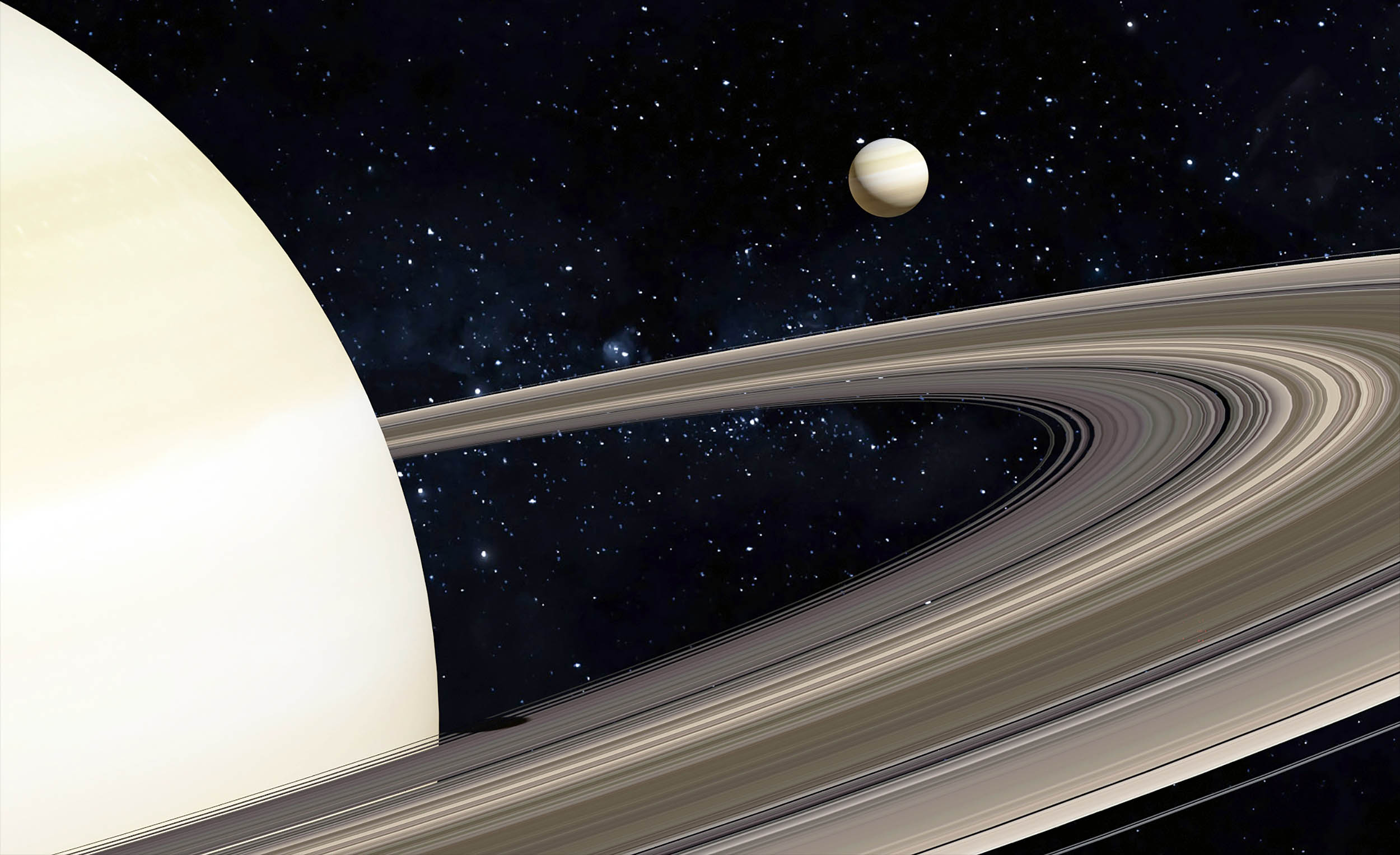 Tiny moon of Saturn exerts unexpected forces on the entire solar system