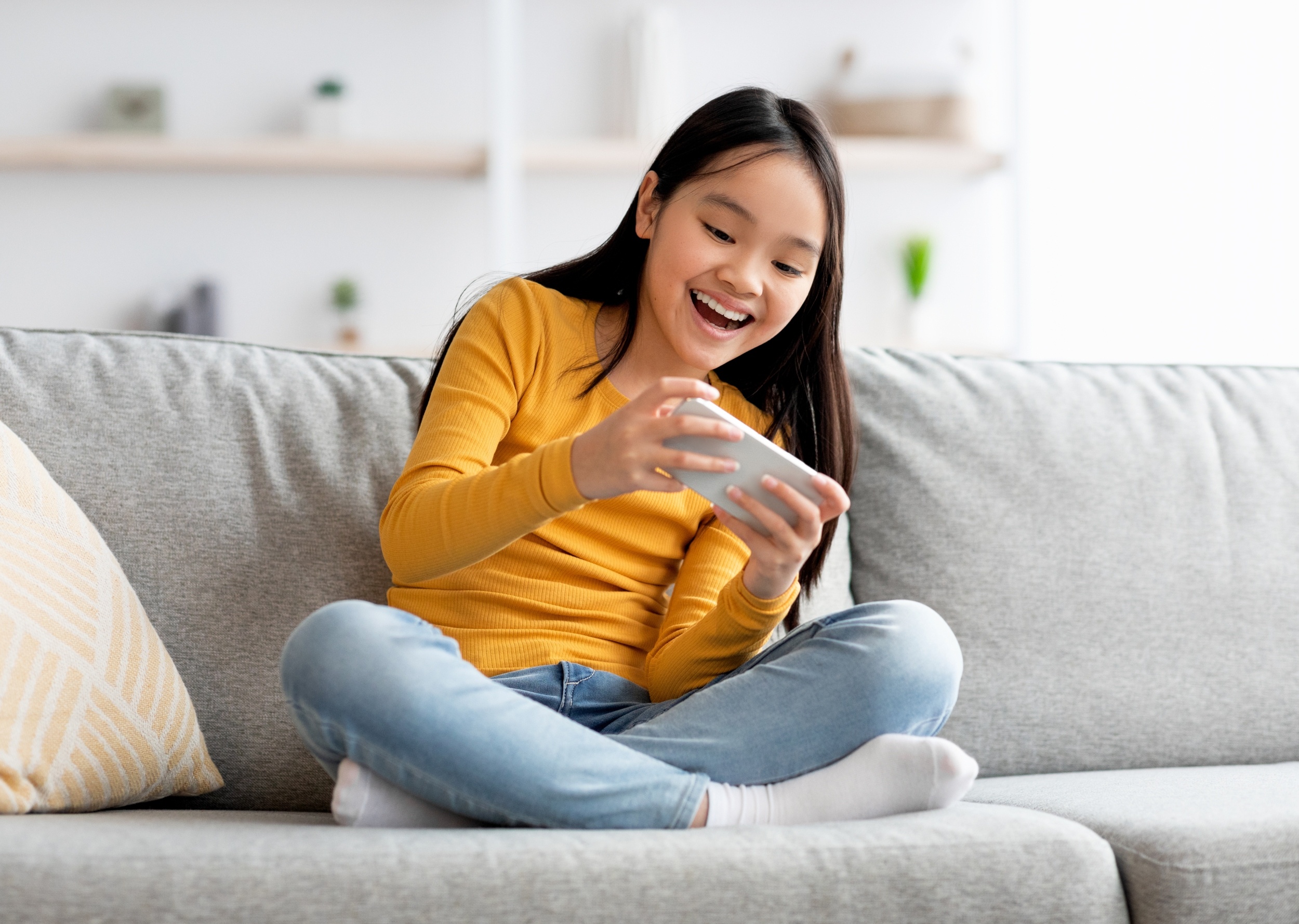 Children who own phones score lower on tests, even when they leave them at home