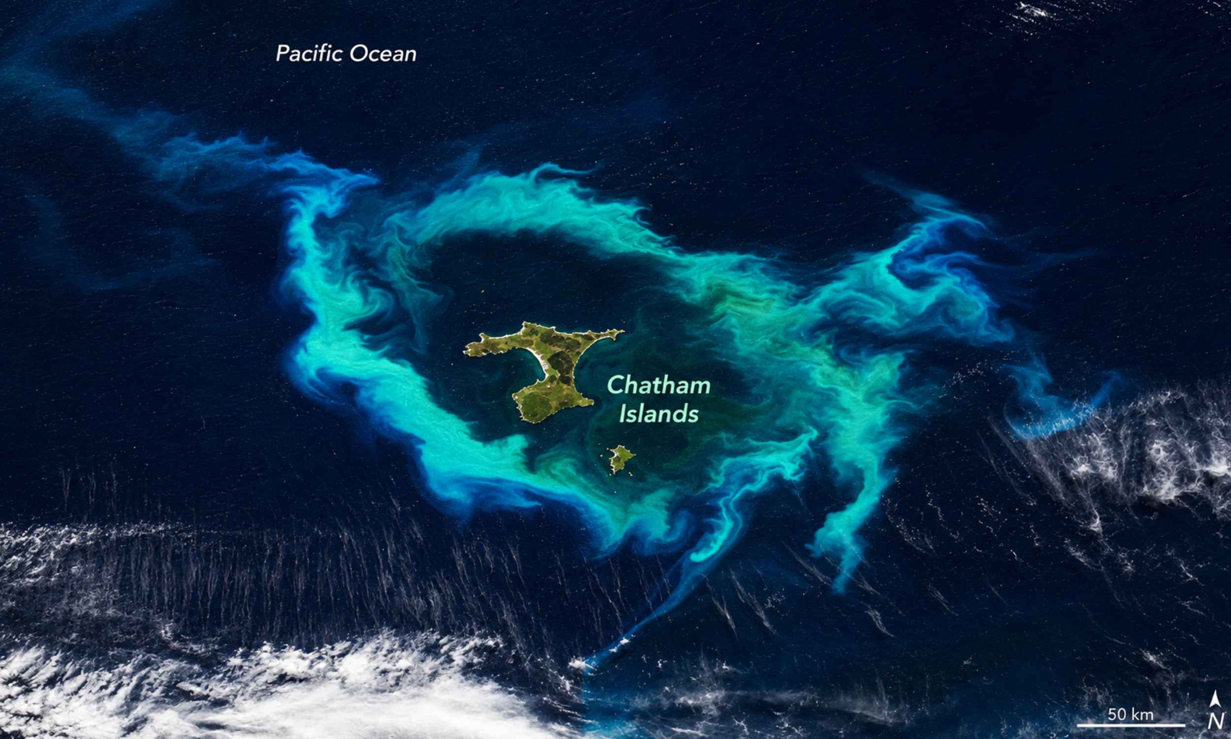 NASA satellite captures a spectacular turquoise halo around the Chatham Islands, and an underwater plateau nearly 500 miles long could be the cause of this strange ocean phenomenon